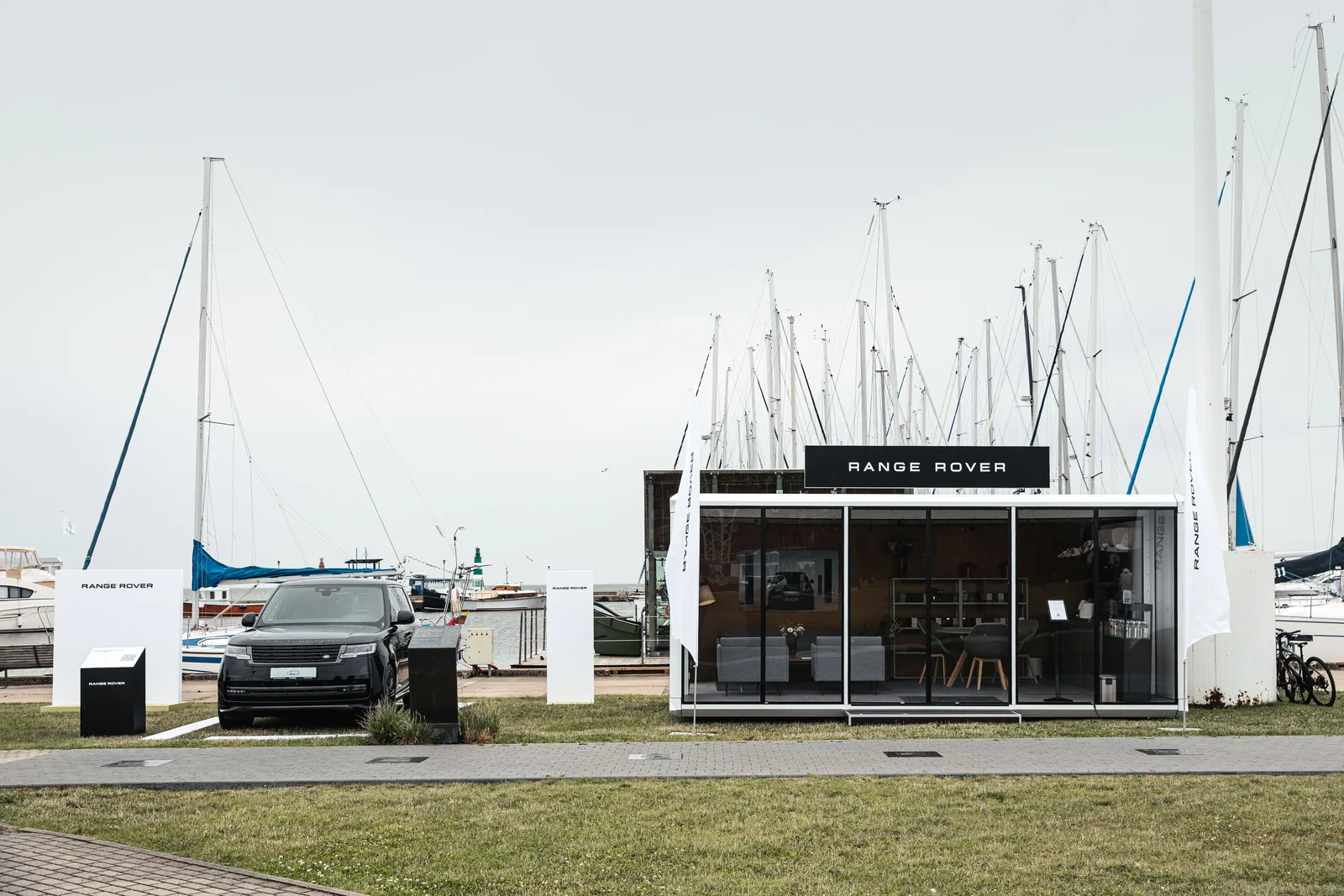 The module opened on the grass at Nida marina, masts behind it