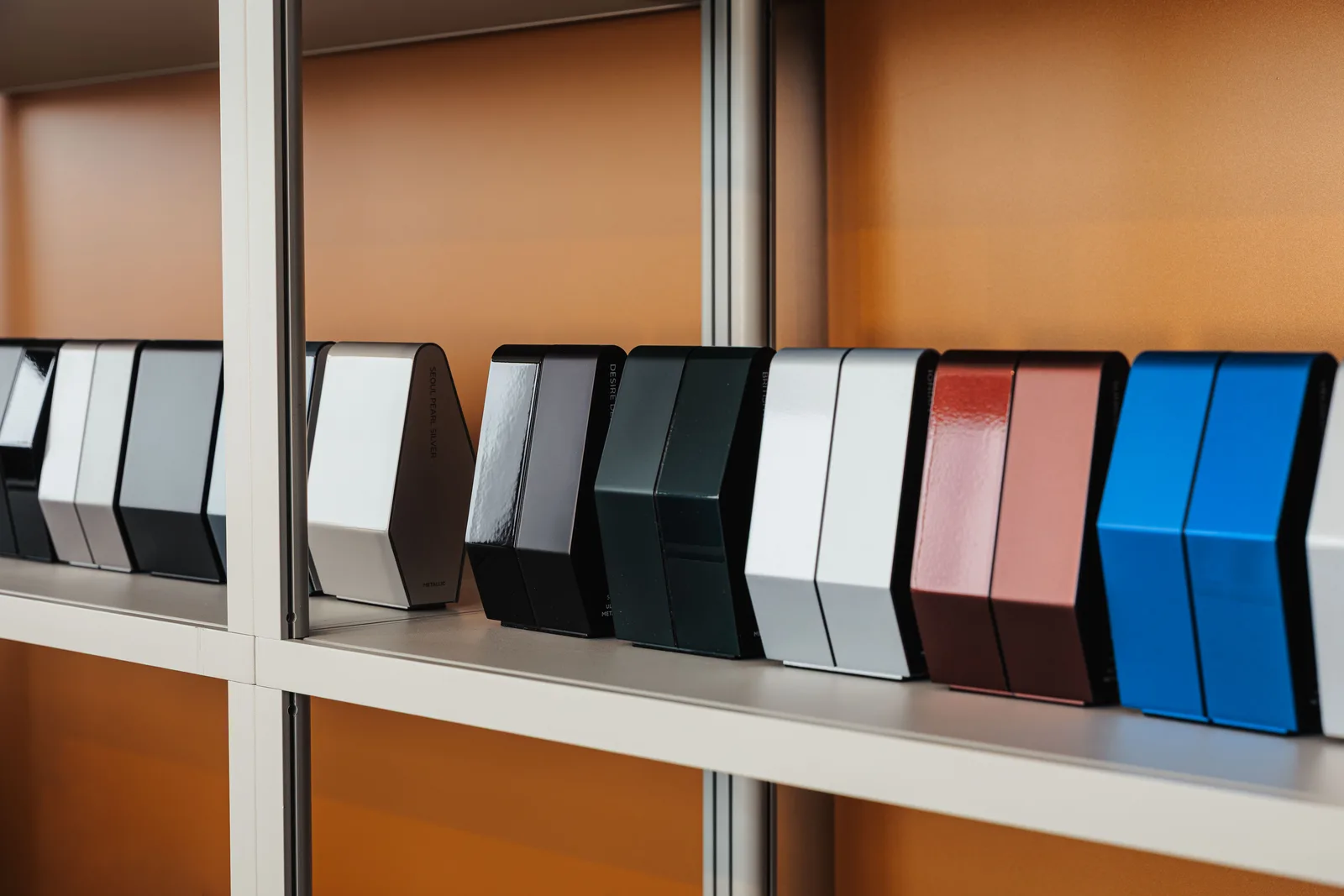 Paint sample panels on a shelf